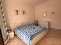 A bed or beds in a room at Appartamento U scrusciu ro mari