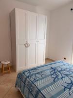 A bed or beds in a room at Appartamento U scrusciu ro mari