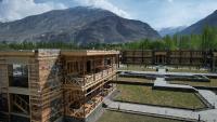 a building under construction with mountains in the background at Rivage Resort Skardu in Shigar