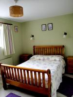Postel nebo postele na pokoji v ubytování Ardrinane House
