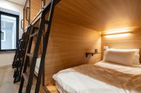 Ein Bett oder Betten in einem Zimmer der Unterkunft Boro Hanok Hostel in Myeongdong