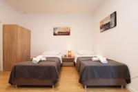 Posteľ alebo postele v izbe v ubytovaní Apartments Lada