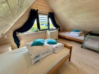 Posteľ alebo postele v izbe v ubytovaní Delfinek - Domki Apartamenty