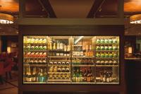 a display case filled with lots of bottles of alcohol at Shizukuishi Prince Hotel in Shizukuishi