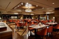 a restaurant with tables and chairs in a room at Shizukuishi Prince Hotel in Shizukuishi