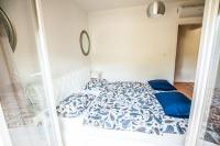 Posteľ alebo postele v izbe v ubytovaní Dadule Apartments
