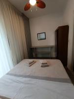A bed or beds in a room at Sea View Palio Apartment