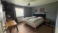 Ein Bett oder Betten in einem Zimmer der Unterkunft Guest Home Oksbøl