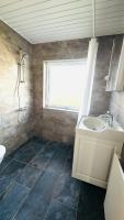 Ein Badezimmer in der Unterkunft Guest Home Oksbøl