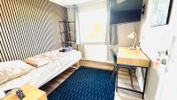 Ein Bett oder Betten in einem Zimmer der Unterkunft Guest Home Oksbøl