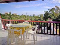 A balcony or terrace at Holiday homes in Santa Margherita di Pula