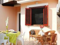 A seating area at Holiday homes in Santa Margherita di Pula