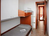 A bed or beds in a room at Holiday homes in Santa Margherita di Pula