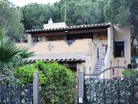 A garden outside Holiday homes in Santa Margherita di Pula