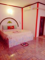 Postel nebo postele na pokoji v ubytování Jidapha Rooms