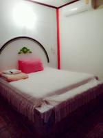 Postel nebo postele na pokoji v ubytování Jidapha Rooms