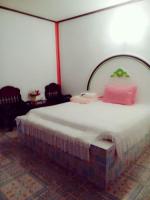 Postel nebo postele na pokoji v ubytování Jidapha Rooms