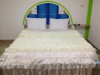 Postel nebo postele na pokoji v ubytování Jidapha Rooms