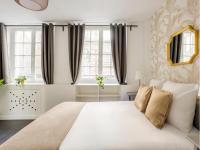 Posteľ alebo postele v izbe v ubytovaní Cozy Apartment - Louvre - ND des Victoires
