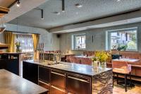 A kitchen or kitchenette at Boutiquehotel ZOMM in Seefeld