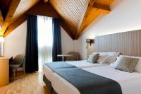 Cama o camas de una habitación en Hotel Silken Villa de Laguardia