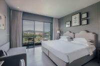 Sugar Marina Hotel -AVIATOR- Phuket Airportにあるベッド