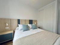 Postel nebo postele na pokoji v ubytování Apartamentos Turísticos Santo Rostro