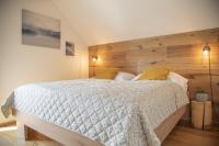 Postel nebo postele na pokoji v ubytování Nora Apartments