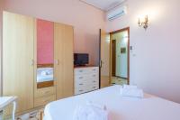A bed or beds in a room at Casa Graziella the top holiday home