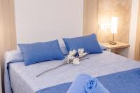 Postel nebo postele na pokoji v ubytování Apartamentos Maribel