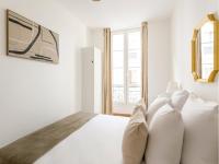 Posteľ alebo postele v izbe v ubytovaní Cozy Apartment - Opera - Caumartin I