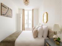 Posteľ alebo postele v izbe v ubytovaní Cozy Apartment - Opera - Caumartin I