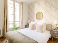 Posteľ alebo postele v izbe v ubytovaní Cozy Apartment - Opera - Caumartin I