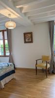 Łóżko lub łóżka w pokoju w obiekcie La Maison d'à Côté
