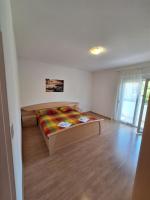 Posteľ alebo postele v izbe v ubytovaní APARTMANI LANA