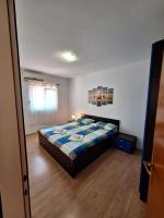 Posteľ alebo postele v izbe v ubytovaní APARTMANI LANA