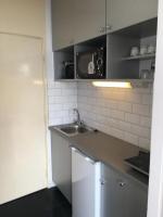 Kuchyňa alebo kuchynka v ubytovaní Milan Apartmanok