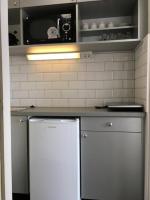 Kuchyňa alebo kuchynka v ubytovaní Milan Apartmanok