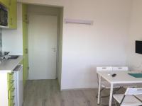Kuchyňa alebo kuchynka v ubytovaní Milan Apartmanok