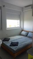 Posteľ alebo postele v izbe v ubytovaní Milan Apartmanok