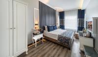 A bed or beds in a room at Beyazit Palace Hotel