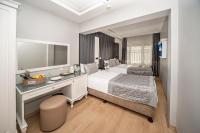 A bed or beds in a room at Beyazit Palace Hotel