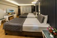 A bed or beds in a room at Beyazit Palace Hotel