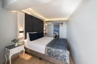 A bed or beds in a room at Beyazit Palace Hotel