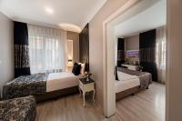 A bed or beds in a room at Beyazit Palace Hotel