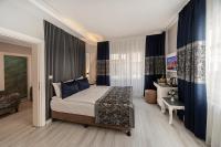 A bed or beds in a room at Beyazit Palace Hotel