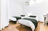 Posteľ alebo postele v izbe v ubytovaní Laramond Barcelona Rooms