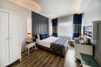 A bed or beds in a room at Beyazit Palace Hotel