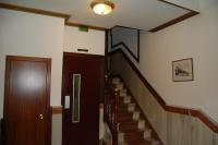 a staircase in a building with a door and a stair case at Hotel Marina Victoria in Algeciras