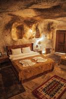 Postel nebo postele na pokoji v ubytování Cappadocia Snora Cave